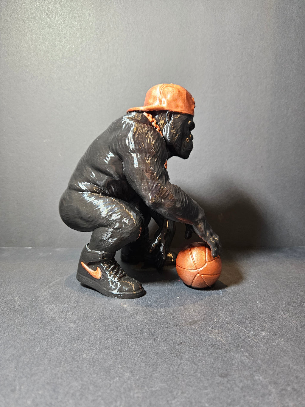 **Courtside King – 22cm Basketball Gorilla Sculpture | $55**