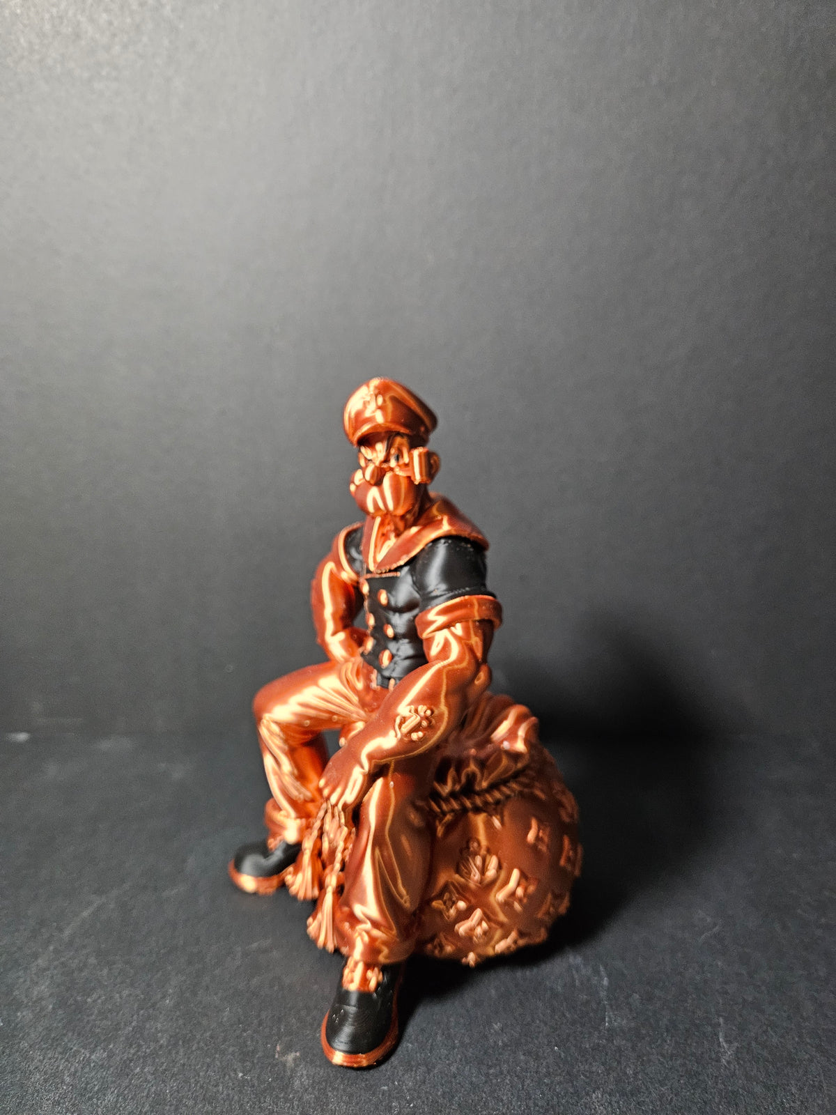 # Heading  Designer Popeye Sculpture – 18cm | Black & Copper Silk | $55