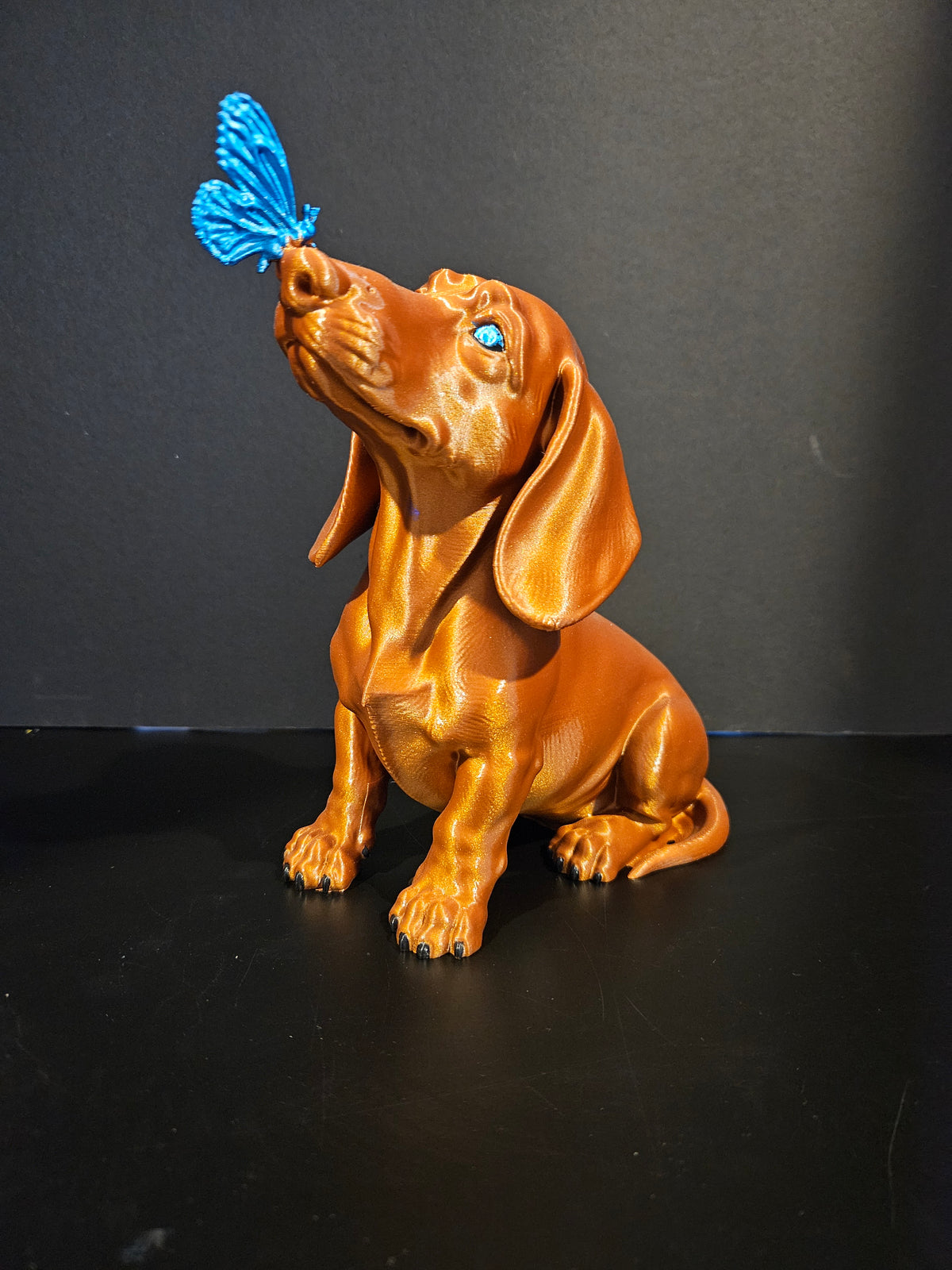 Butterfly Kisses – Dachshund Sculpture