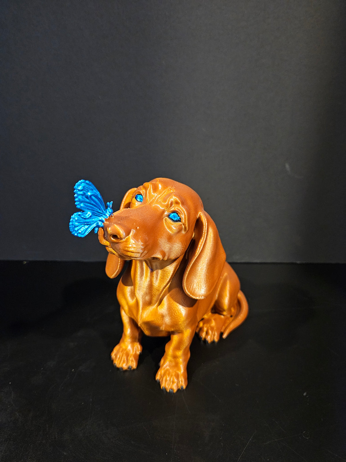 Butterfly Kisses – Dachshund Sculpture