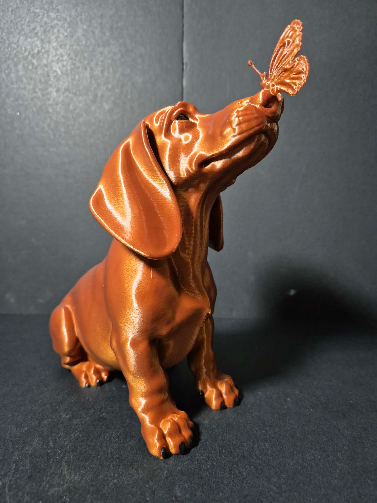 Butterfly Kiss Dachshund Sculpture – 20cm