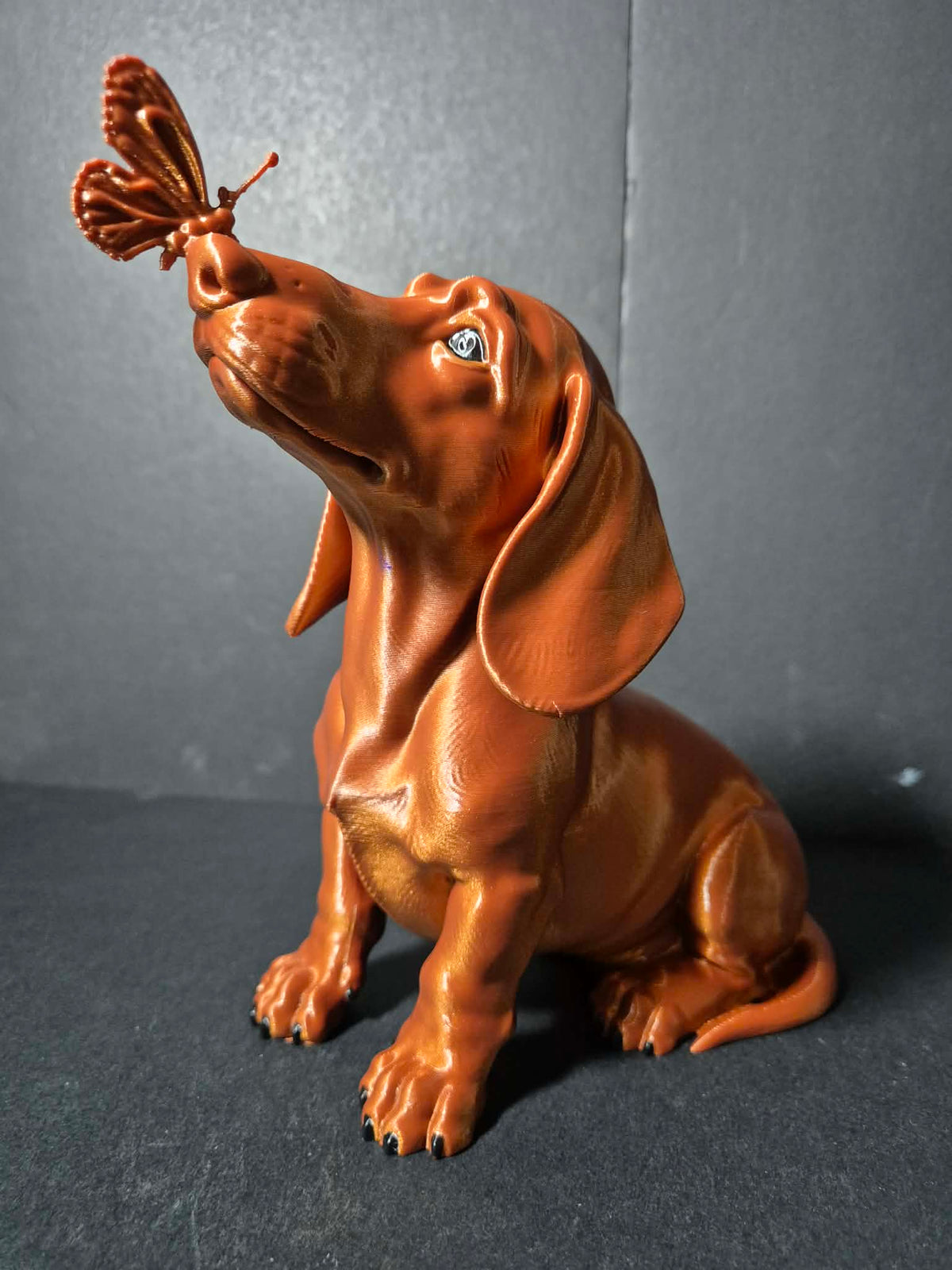 Butterfly Kiss Dachshund Sculpture – 20cm